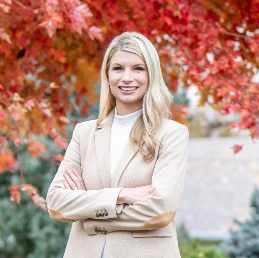 U.S. Representative Brittany Pettersen against red autumn foliage